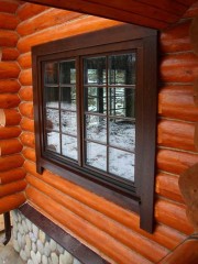 Plastic window in a wooden house