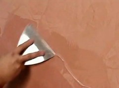 applying wax to the Venetian plaster